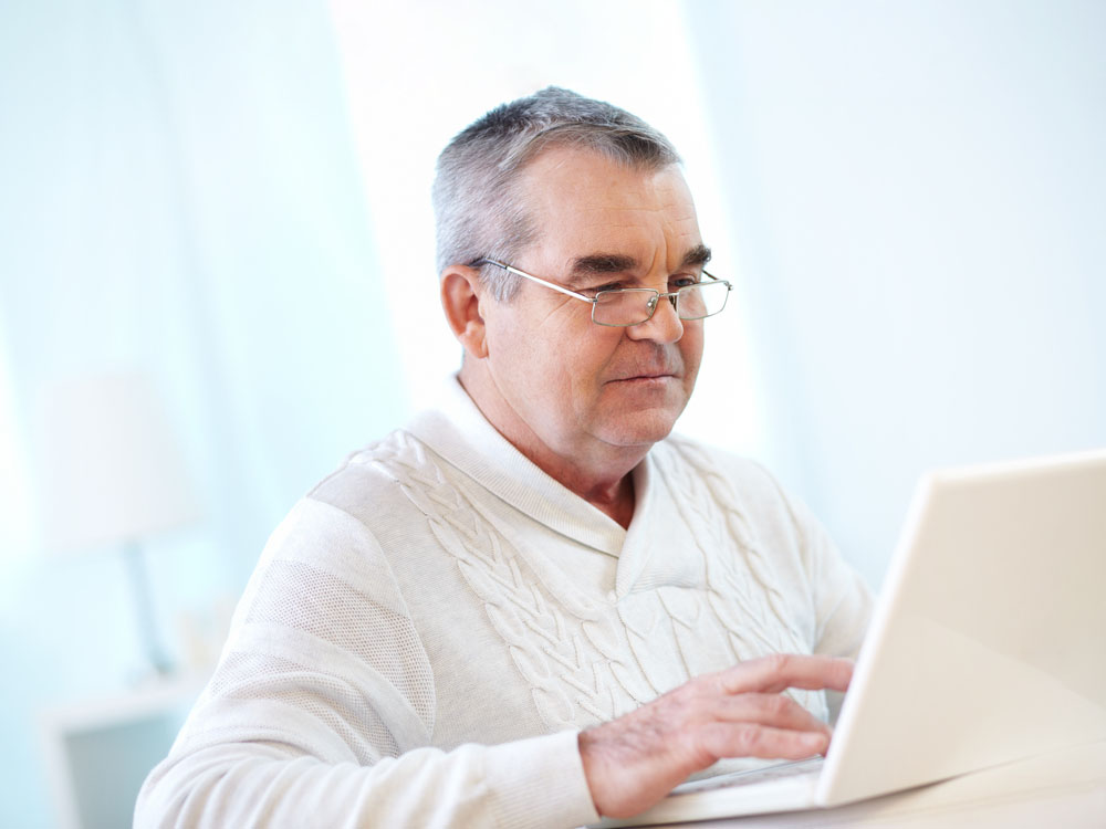 Portrait,Of,Pensive,Mature,Man,Working,With,Laptop